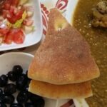Moroccan Flat Bread Beside Black Olives Lentil Soup And Moroccan Salad
