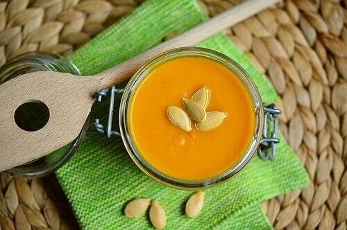 Bowl of Onion Squash Soup on Green Cloth